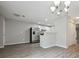 Dining area view includes stainless steel refrigerator and partial kitchen view at 1575 April Ln, Morrow, GA 30260