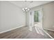 Well-lit dining room featuring hardwood floors and sliding glass doors to outdoor area at 1575 April Ln, Morrow, GA 30260