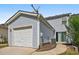 Attached one car garage, siding and sliding glass door to the patio at 1575 April Ln, Morrow, GA 30260