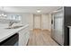 Modern kitchen features stainless steel appliances, ample countertop space, and stylish wood grain flooring at 1575 April Ln, Morrow, GA 30260