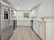 Modern kitchen with stainless steel appliances, white cabinets, and quartz countertops at 1575 April Ln, Morrow, GA 30260