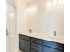 Bathroom featuring double sinks, modern fixtures, and a glass-enclosed shower at 2620 Mackintosh Ct # 19, Brookhaven, GA 30319