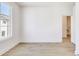 Bedroom with light hardwood floors and bright window at 2620 Mackintosh Ct # 19, Brookhaven, GA 30319