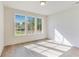 Bright bedroom showcasing three windows and hardwood floors at 2620 Mackintosh Ct # 19, Brookhaven, GA 30319