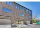 Exterior of a townhome, showing brick facade and three garage doors at 2620 Mackintosh Ct # 19, Brookhaven, GA 30319