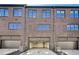 Exterior view of a townhome, featuring brick facade and garage access at 2620 Mackintosh Ct # 19, Brookhaven, GA 30319
