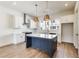 Modern kitchen featuring an island, white cabinetry, stainless steel appliances, and hardwood floors at 2620 Mackintosh Ct # 19, Brookhaven, GA 30319