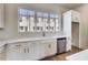 Kitchen area with quartz counters, stainless steel appliances, and window view of the neighborhood at 2620 Mackintosh Ct # 19, Brookhaven, GA 30319