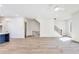 Open-concept living space featuring hardwood floors, neutral paint, and staircase at 2620 Mackintosh Ct # 19, Brookhaven, GA 30319