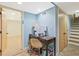 Partially finished basement features an office space with a desk and stairs leading to the upper level at 3658 Brock Rd, Duluth, GA 30096