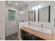 Modern bathroom with double sinks, sleek vanities, updated shower and modern fixtures at 3658 Brock Rd, Duluth, GA 30096