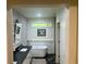 Stylish bathroom featuring a freestanding tub, modern fixtures, and chic geometric wallpaper at 3658 Brock Rd, Duluth, GA 30096