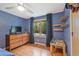 Bedroom with hardwood floors, a ceiling fan, dresser and a window with nature view at 3658 Brock Rd, Duluth, GA 30096