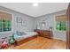 Cozy bedroom with hardwood floors, natural light, and colorful decor, creating a cheerful space at 3658 Brock Rd, Duluth, GA 30096