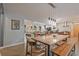 Open-concept dining area featuring modern lighting, and view into the living room, perfect for gatherings at 3658 Brock Rd, Duluth, GA 30096