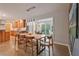 Open-concept dining area featuring modern lighting and hardwood floors, perfect for entertaining at 3658 Brock Rd, Duluth, GA 30096