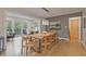 Charming dining room with a wooden table, unique decor, an adjacent study, and access to the outside deck at 3658 Brock Rd, Duluth, GA 30096