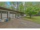 Long driveway leading to a well-kept home with a two-car garage and landscaped yard at 3658 Brock Rd, Duluth, GA 30096