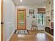 Entryway with stylish door, built-in shelving, and hardwood floors, offering a welcoming space at 3658 Brock Rd, Duluth, GA 30096