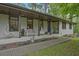 Inviting front porch with swing chairs and seating, creating a relaxing outdoor space at 3658 Brock Rd, Duluth, GA 30096