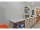 Well-lit kitchen features white countertops and cabinetry with a unique fruit basket rack at 3658 Brock Rd, Duluth, GA 30096