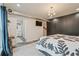 Spacious main bedroom featuring closet, a modern bed, and a connecting bathroom at 3658 Brock Rd, Duluth, GA 30096