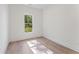 Bright bedroom with hardwood floors, a large window, and ample natural light at 668 Crest Line Trl, Powder Springs, GA 30127