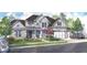 Charming two-story home featuring a landscaped front yard, a two-car garage, and covered front porch at 668 Crest Line Trl, Powder Springs, GA 30127