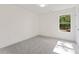 Carpeted bedroom with bright trim, a large window and a ceiling light at 699 Crest Line W Trl, Powder Springs, GA 30127