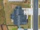 An aerial view of the home's roof, driveway and yard at 1395 Crestwind Nw Rd, Kennesaw, GA 30152