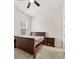 Bedroom with bed, nightstand, ceiling fan and carpet at 1395 Crestwind Nw Rd, Kennesaw, GA 30152