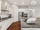 Modern kitchen features white cabinets, stainless steel appliances, and a gas cooktop stove on granite countertops at 1395 Crestwind Nw Rd, Kennesaw, GA 30152