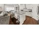 Modern kitchen with a center island, stainless steel appliances, and an open layout connected to the living area at 1395 Crestwind Nw Rd, Kennesaw, GA 30152
