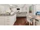 Open concept kitchen with island and dining area at 1395 Crestwind Nw Rd, Kennesaw, GA 30152