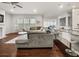Spacious open-concept living area with hardwood floors, a fireplace, and a view into the kitchen at 1395 Crestwind Nw Rd, Kennesaw, GA 30152