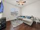 Cozy living room features a comfortable sectional sofa, plush rug, and a large window at 1395 Crestwind Nw Rd, Kennesaw, GA 30152