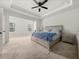 Spacious main bedroom with tray ceiling, ceiling fan, and large windows at 1395 Crestwind Nw Rd, Kennesaw, GA 30152