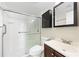 Well-lit bathroom featuring a shower with a glass door and sleek, dark vanity with a modern sink at 287 14Th Nw St # 8, Atlanta, GA 30318