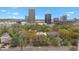 Stunning city skyline view featuring lush trees, residential buildings, and a beautiful blue sky at 287 14Th Nw St # 8, Atlanta, GA 30318