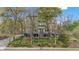 Multi-story building with large windows, trees in front, and landscaped walkway to the entrance at 287 14Th Nw St # 8, Atlanta, GA 30318