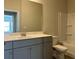 A bathroom with a large mirror, double vanity, and a shower-tub combo at 3908 Shelleydale Dr, Powder Springs, GA 30127