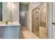 This bathroom boasts tile floors, a glass enclosed shower, and double sinks at 3908 Shelleydale Dr, Powder Springs, GA 30127
