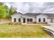 Charming single-story home with a well-manicured lawn, complemented by a mix of brick and white wood siding at 3908 Shelleydale Dr, Powder Springs, GA 30127