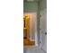 Neutral paint colors and a partial view of the bathroom are featured in this hallway at 3908 Shelleydale Dr, Powder Springs, GA 30127