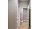 This hallway features hard surface flooring and doors leading to other rooms at 3908 Shelleydale Dr, Powder Springs, GA 30127