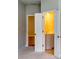 The hallway leads to the bathroom with white painted doors and gray walls at 3908 Shelleydale Dr, Powder Springs, GA 30127
