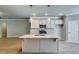 Bright kitchen with an island, stylish pendant lighting, and stainless steel appliances provides a modern and inviting space at 3908 Shelleydale Dr, Powder Springs, GA 30127