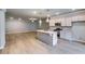 Modern kitchen featuring an island with a sink and stainless steel appliances, creating a stylish and functional cooking space at 3908 Shelleydale Dr, Powder Springs, GA 30127