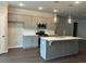 Kitchen with gray cabinets, stainless steel appliances, and a large island with pendant lighting at 3908 Shelleydale Dr, Powder Springs, GA 30127