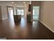 Open-concept living room with wood flooring, recessed lighting, and kitchen island at 3908 Shelleydale Dr, Powder Springs, GA 30127